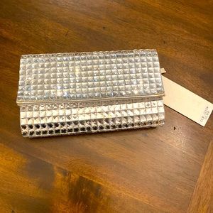 New! W/tags. Crystal like clutch with optional silver chain.